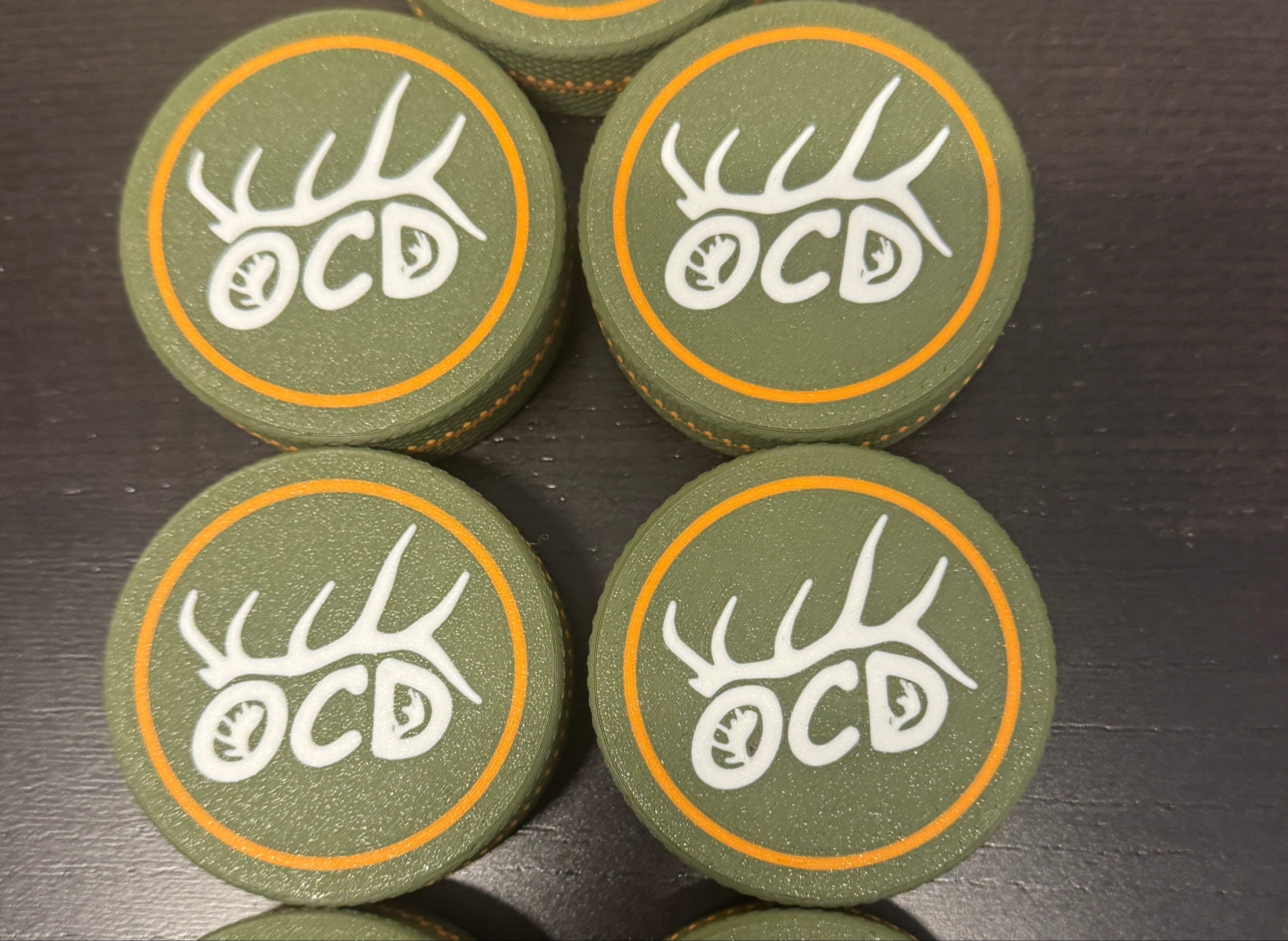 Set of green customized Pucks
