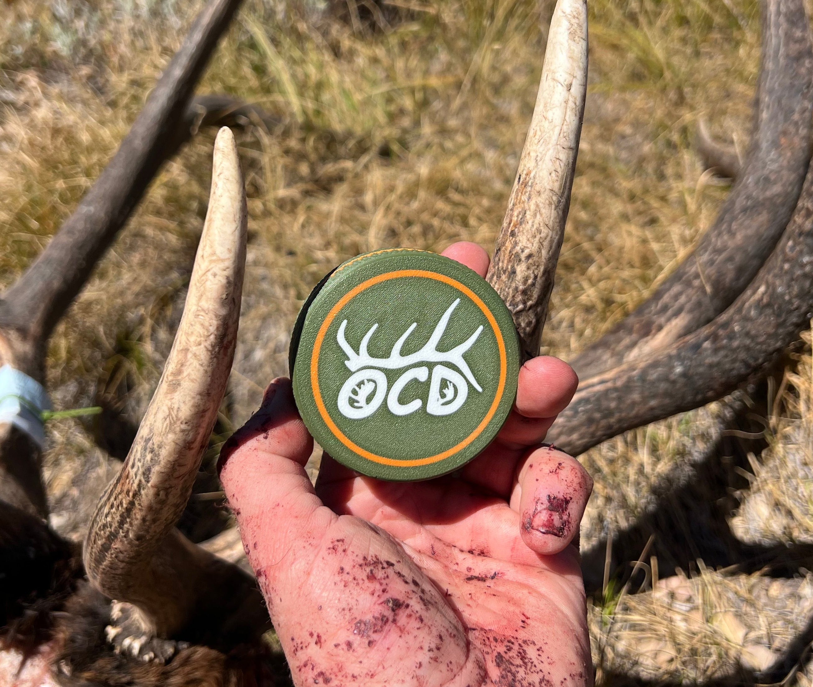Bloody hand holding a customized Puck